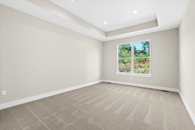 2080 Crested Butte Dr, White Lake, MI 48383 - empty room featuring baseboards, carpet floors, recessed lighting, and a tray ceiling