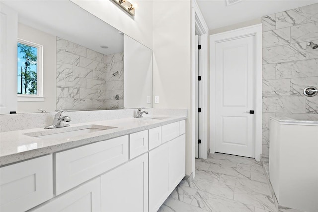 2080 Crested Butte Dr, White Lake, MI 48383 - bathroom with marble look tiles, a tile shower, and double vanity