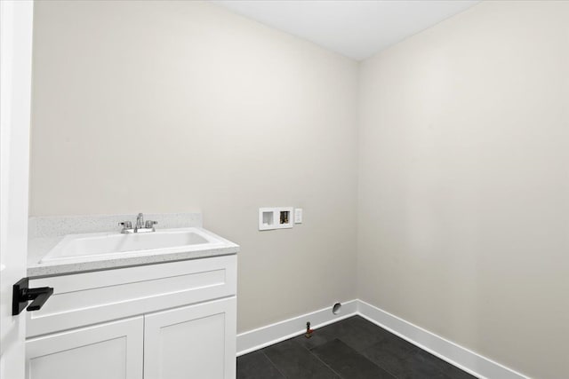 2080 Crested Butte Dr, White Lake, MI 48383 - laundry room with washer hookup, a sink, baseboards, and hookup for a gas dryer