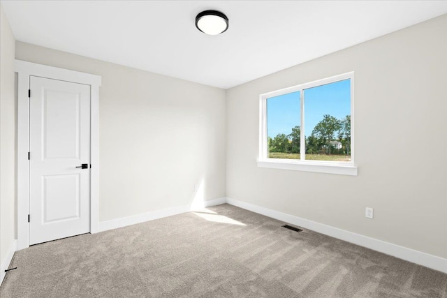 2080 Crested Butte Dr, White Lake, MI 48383 - spare room featuring baseboards and carpet floors