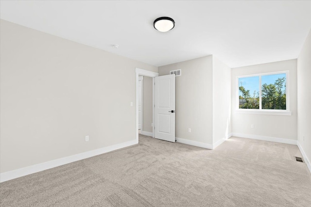 2080 Crested Butte Dr, White Lake, MI 48383 - spare room featuring light colored carpet and baseboards