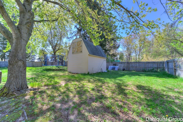 1573 N Whitehall Rd, Muskegon, MI 49445 - view of yard with a trampoline, an outdoor structure, and a shed