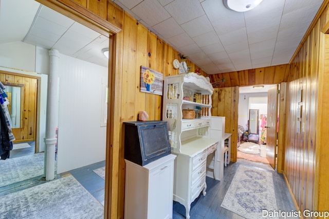 1573 N Whitehall Rd, Muskegon, MI 49445 - bathroom featuring wood walls, vaulted ceiling, and wood finished floors