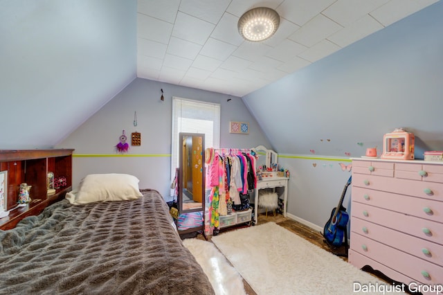 1573 N Whitehall Rd, Muskegon, MI 49445 - bedroom with lofted ceiling and baseboards