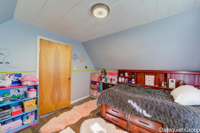 1573 N Whitehall Rd, Muskegon, MI 49445 - bedroom with vaulted ceiling and baseboards