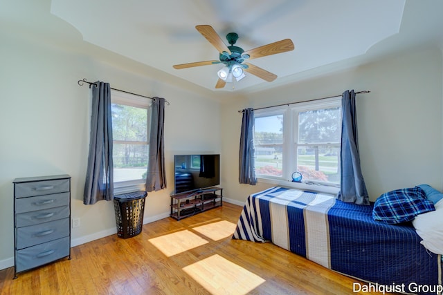 1573 N Whitehall Rd, Muskegon, MI 49445 - bedroom with wood finished floors, baseboards, and ceiling fan