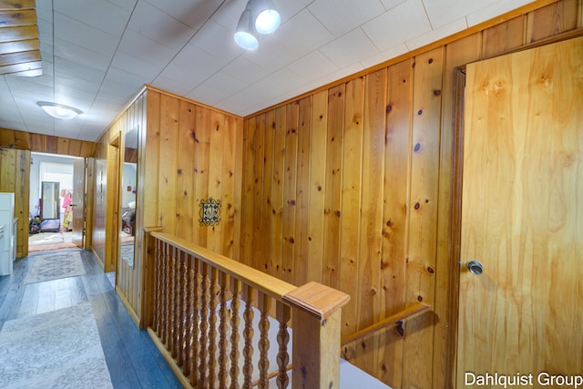 1573 N Whitehall Rd, Muskegon, MI 49445 - hall with wood walls and hardwood / wood-style flooring