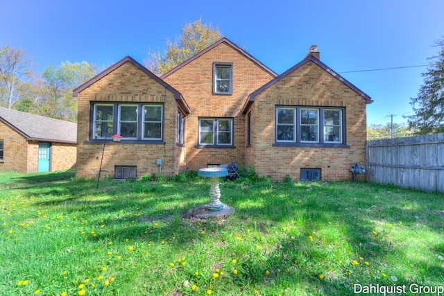 1573 N Whitehall Rd, Muskegon, MI 49445 - tudor house featuring brick siding and a chimney