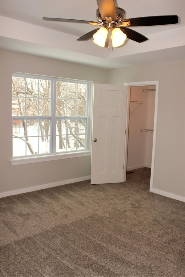 00 High Slope Dr, Brighton, MI 48114 - unfurnished bedroom with carpet floors, a spacious closet, baseboards, and a closet