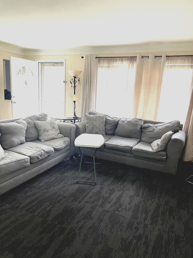 living room featuring healthy amount of natural light and carpet floors