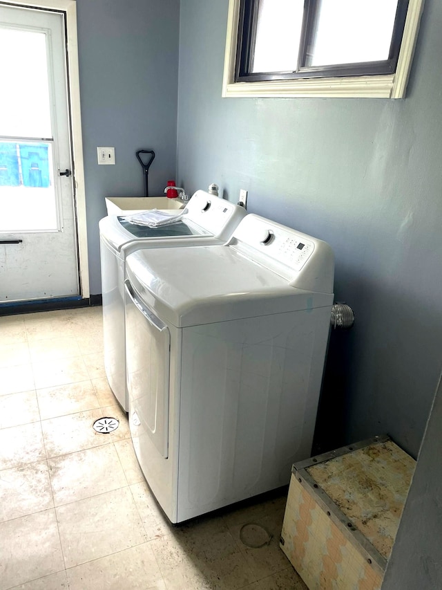 laundry room featuring washing machine and clothes dryer