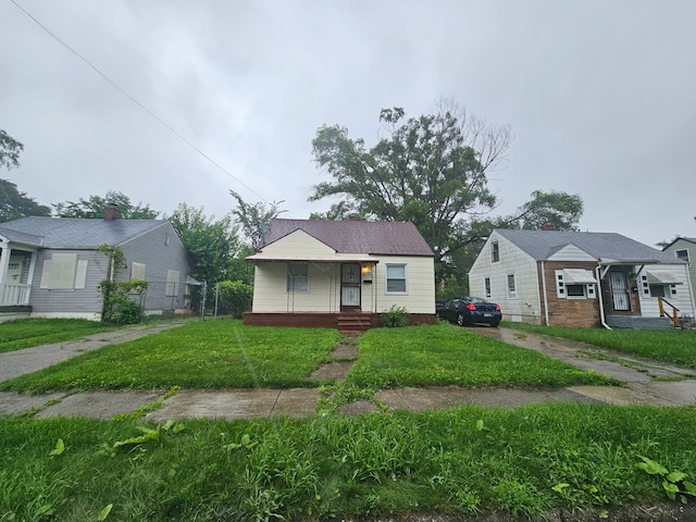 19700 Binder St, Detroit, MI 48234 - bungalow-style house with a front lawn and a porch