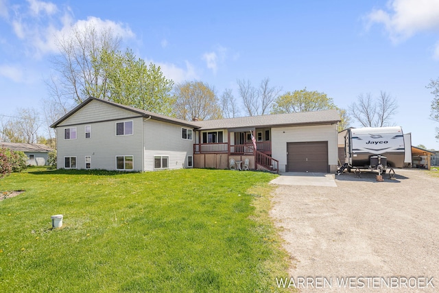 11774 Tyler St, Holland, MI 49424 - ranch-style house featuring driveway, a garage, a front yard, and a porch