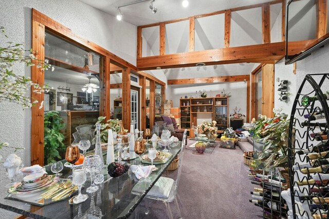 19303 Fenmore St, Detroit, MI 48235 - carpeted dining room with high vaulted ceiling, track lighting, a textured wall, and ceiling fan