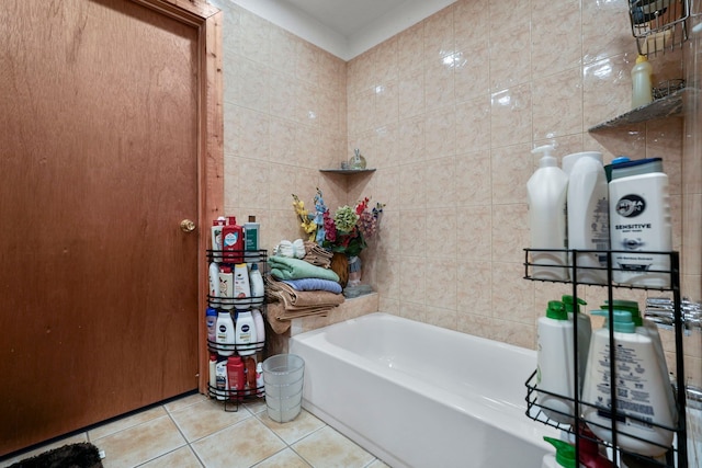 19303 Fenmore St, Detroit, MI 48235 - bathroom with tile patterned floors, tile walls, and a bath
