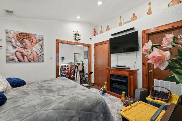 19303 Fenmore St, Detroit, MI 48235 - bedroom with lofted ceiling, recessed lighting, and a fireplace