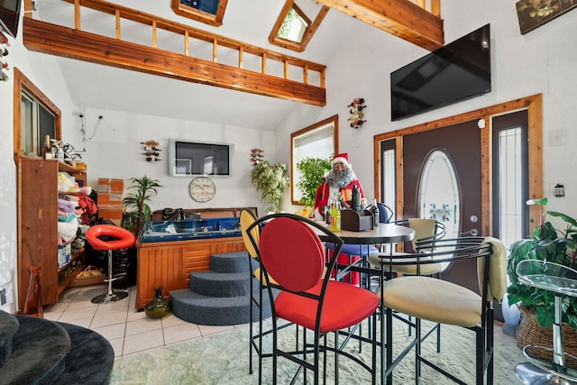 19303 Fenmore St, Detroit, MI 48235 - dining area featuring beam ceiling, light tile patterned flooring, and high vaulted ceiling