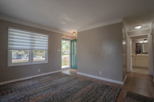 29255 Rymal St, Roseville, MI 48066 - empty room with wood finished floors, ornamental molding, and baseboards