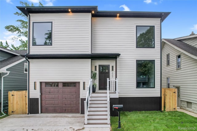 227 W Houstonia Ave, Royal Oak, MI 48073 - modern home featuring a garage, driveway, and a gate