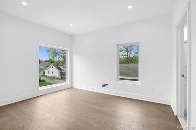 227 W Houstonia Ave, Royal Oak, MI 48073 - empty room with hardwood / wood-style floors, recessed lighting, and baseboards
