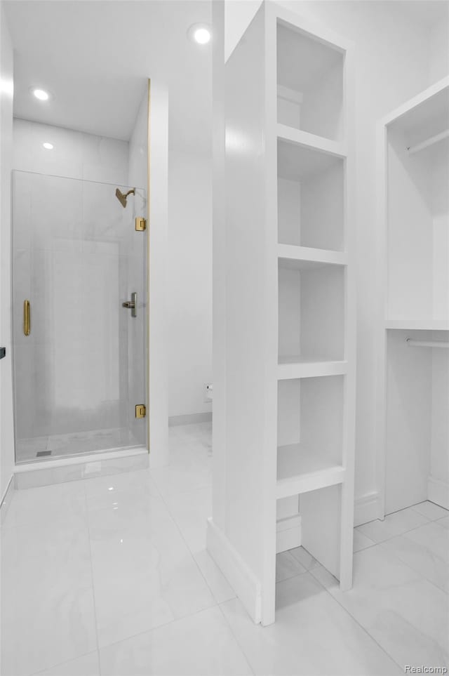 227 W Houstonia Ave, Royal Oak, MI 48073 - bathroom featuring a shower stall, marble look tiles, recessed lighting, built in shelves, and baseboards
