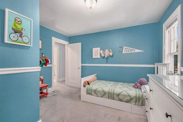 bedroom featuring carpet floors and baseboards
