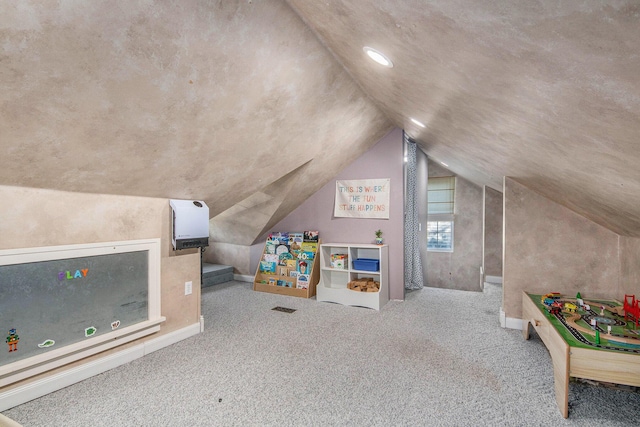 game room featuring lofted ceiling and carpet
