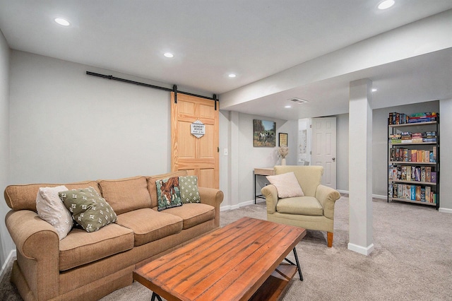 living area featuring light colored carpet, baseboards, recessed lighting, and a barn door