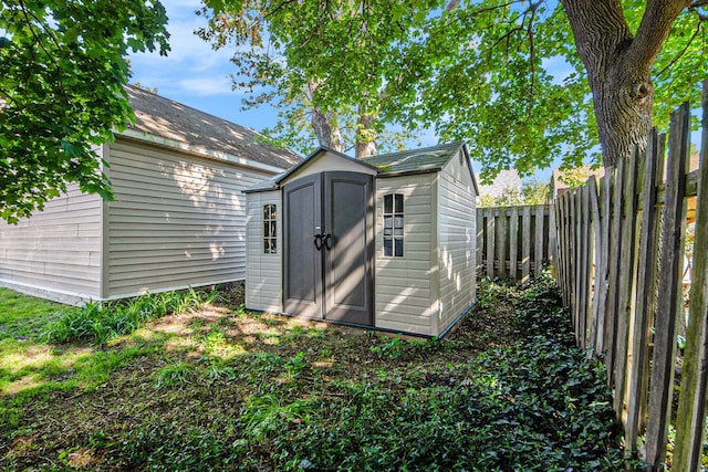 view of shed with a fenced backyard