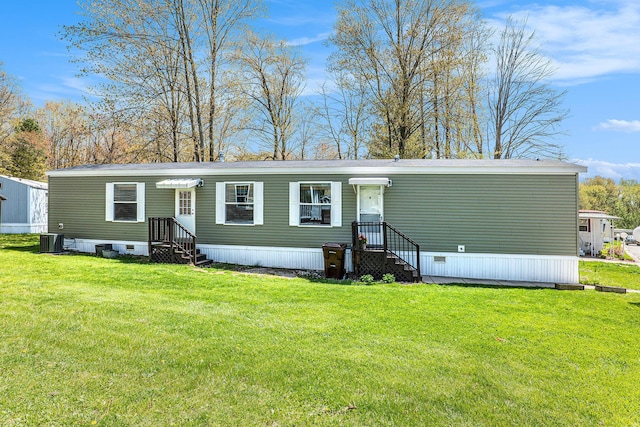 6922 Knotty Pine St NE, Rockford, MI 49341 - view of front of home with a front yard and cooling unit
