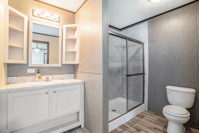 6922 Knotty Pine St NE, Rockford, MI 49341 - full bath featuring wood finished floors, a stall shower, toilet, vanity, and ornamental molding