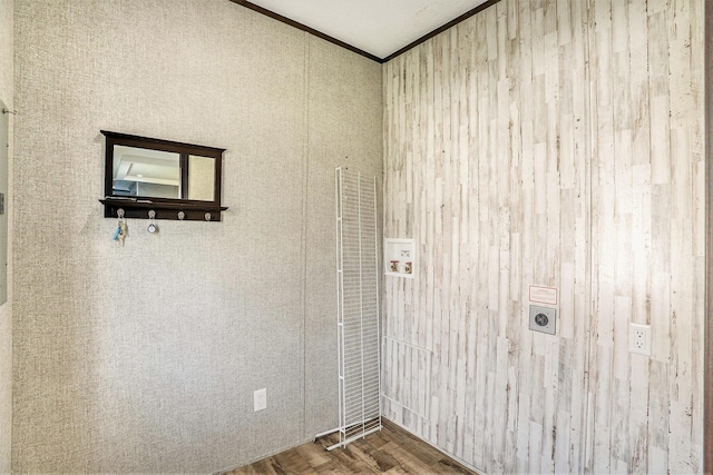 6922 Knotty Pine St NE, Rockford, MI 49341 - clothes washing area with hookup for a washing machine, crown molding, hookup for an electric dryer, and wood finished floors