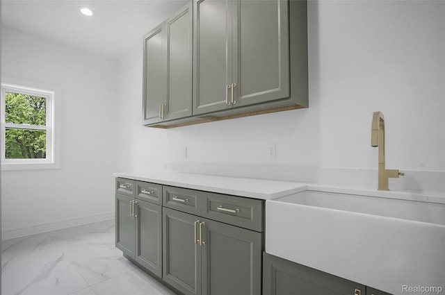 4112 Elmhurst Ave, Royal Oak, MI 48073 - kitchen featuring a sink, light marble finish floors, light countertops, baseboards, and recessed lighting