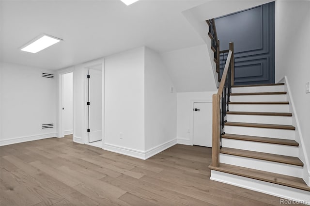 4112 Elmhurst Ave, Royal Oak, MI 48073 - below grade area with wood finished floors, baseboards, and stairs