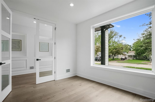 4112 Elmhurst Ave, Royal Oak, MI 48073 - unfurnished bedroom featuring baseboards, wood finished floors, recessed lighting, and french doors