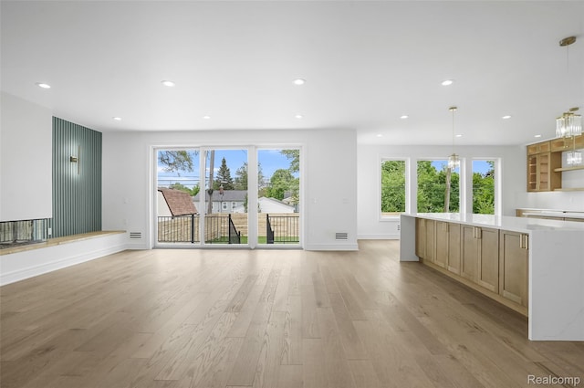 4112 Elmhurst Ave, Royal Oak, MI 48073 - unfurnished living room with light wood finished floors, recessed lighting, and baseboards