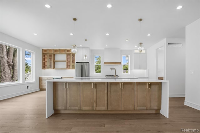 4112 Elmhurst Ave, Royal Oak, MI 48073 - kitchen with high quality fridge, a sink, light countertops, light wood-type flooring, and recessed lighting