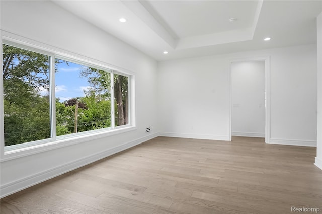 4112 Elmhurst Ave, Royal Oak, MI 48073 - spare room featuring light wood-style floors, recessed lighting, baseboards, and a raised ceiling