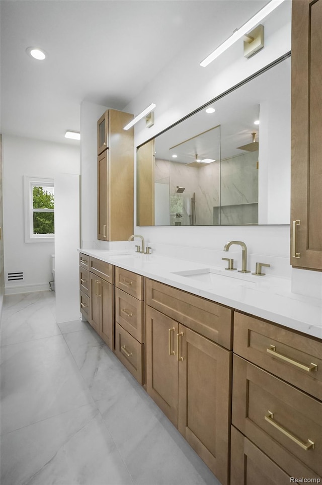 4112 Elmhurst Ave, Royal Oak, MI 48073 - bathroom featuring double vanity, toilet, a marble finish shower, marble finish floors, and a ceiling fan