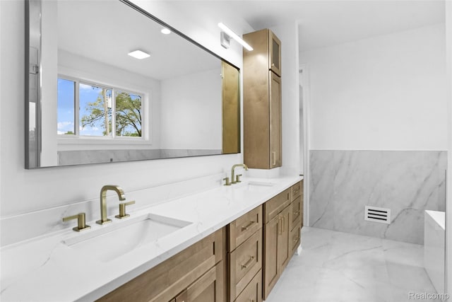 4112 Elmhurst Ave, Royal Oak, MI 48073 - bathroom featuring double vanity and marble finish flooring