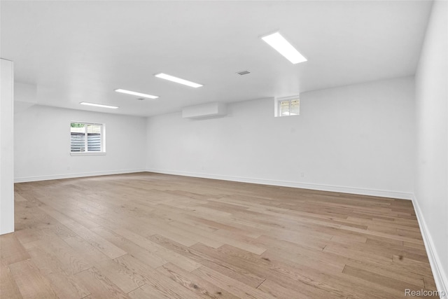 4112 Elmhurst Ave, Royal Oak, MI 48073 - empty room featuring wood finished floors, plenty of natural light, and baseboards