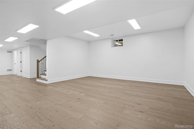 4112 Elmhurst Ave, Royal Oak, MI 48073 - unfurnished room with stairs, light wood finished floors, and baseboards