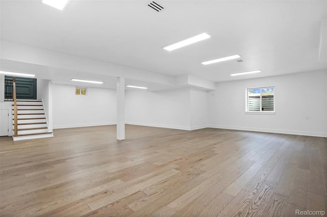 4112 Elmhurst Ave, Royal Oak, MI 48073 - below grade area featuring wood finished floors, stairs, and baseboards