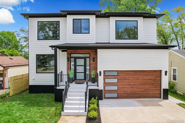 4112 Elmhurst Ave, Royal Oak, MI 48073 - modern home featuring a garage and driveway