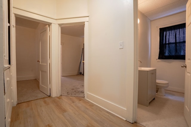 hall with light wood-style floors