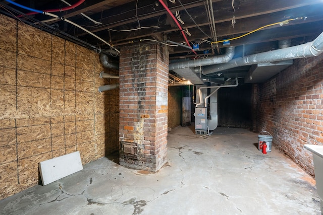 unfinished basement with heating unit