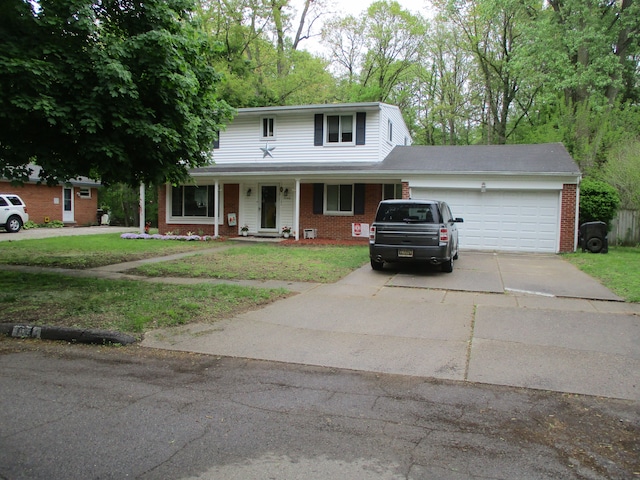 7140 Ridgedale Ln, Lambertville, MI 48144 - traditional home featuring brick siding, an attached garage, driveway, and a front yard