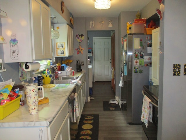 7140 Ridgedale Ln, Lambertville, MI 48144 - kitchen with freestanding refrigerator, light countertops, wood finished floors, white cabinets, and a sink