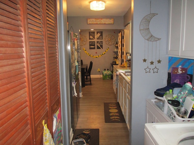 7140 Ridgedale Ln, Lambertville, MI 48144 - clothes washing area featuring wood finished floors and washer / clothes dryer
