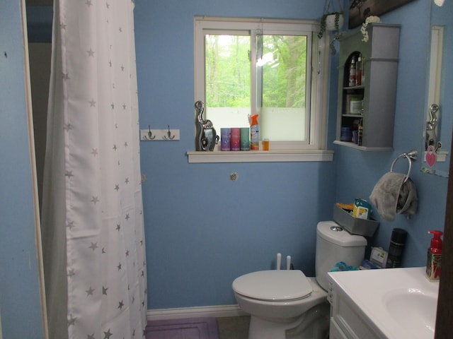 7140 Ridgedale Ln, Lambertville, MI 48144 - bathroom with toilet, vanity, a shower with curtain, and baseboards